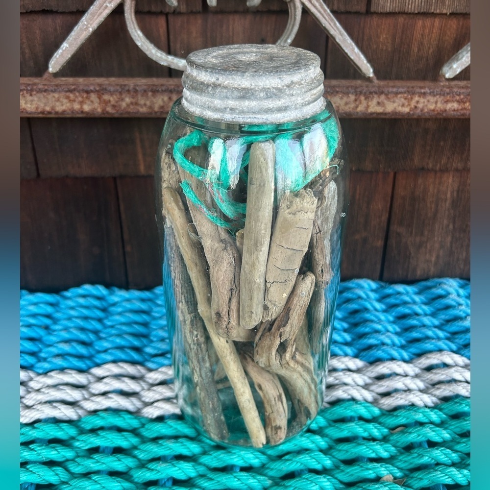 Vintage glass jar with zinc top filled with driftwood and sea rope from Montauk